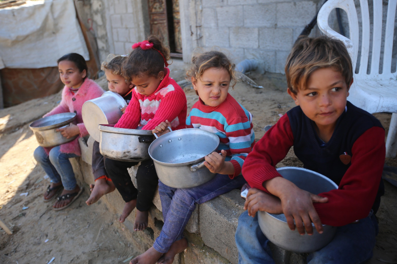 Palestinian Children Waiting for Food with Empty Pots